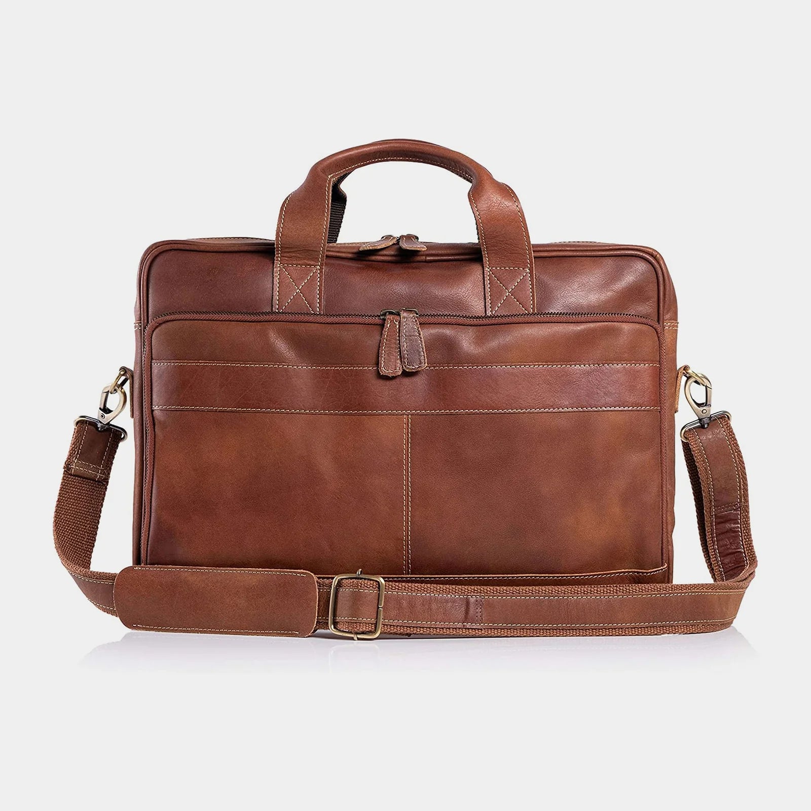 Brown leather briefcase with shoulder strap on a white background